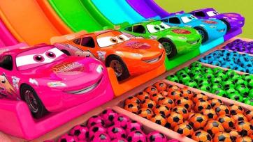 The kids play with cars and colourful balls