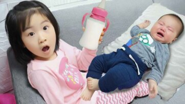 Big Sister’s Gentle Help: Sweet Bottle-Feeding Time With Baby